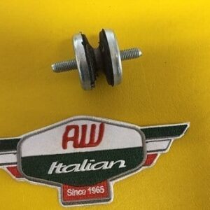 Silver Ferrari Rubber Exhaust Mount Laying on Yellow Background With AW Italian Logo Underneath